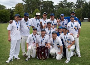 Seville holds shield aloft