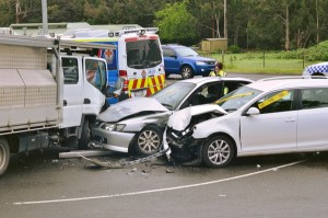 Cars collide with truck