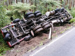 Black Spur truck flips out