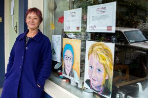Portraits adorn shopfronts