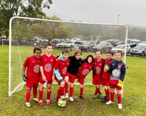 Cold and wet, kids play on